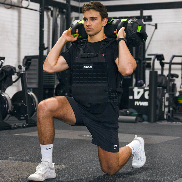 Man lunging with core bag behind his head wearing the SMAI weight vest adjustable black